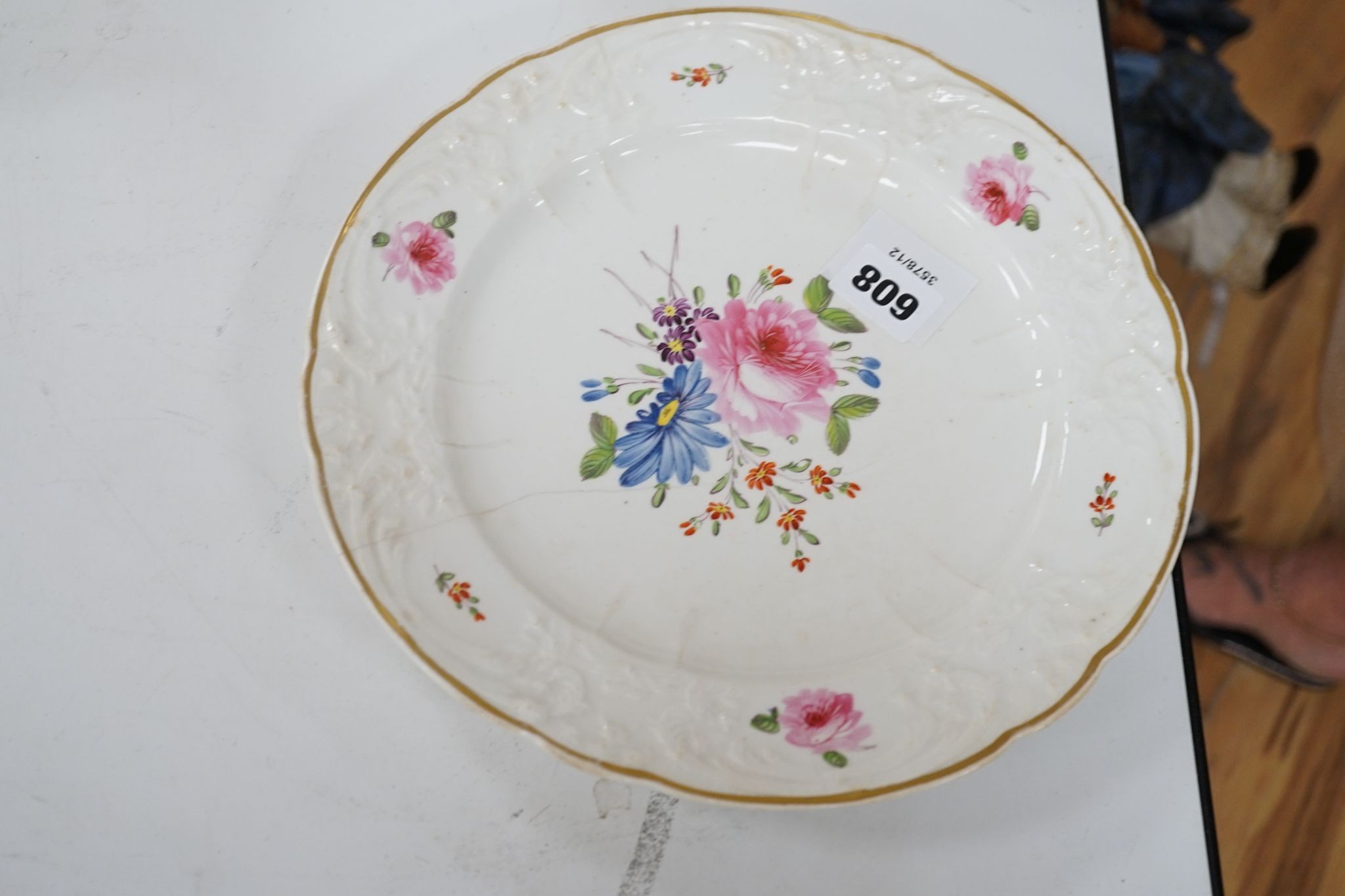 A 19th century floral painted part dinner service